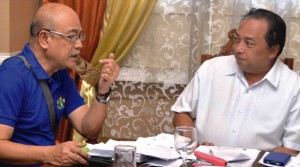 POWER NEED. Gov. Edgar Chatto discusses the power situation in Bohol with DOW Regional Director Antonio Labios during the meeting of the Bohol Energy Development Authority Group (BEDAG)  at the Governor's Mansion yesterday.