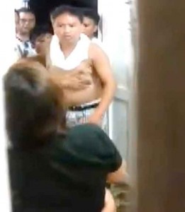 CAUGHT IN THE ACT. Henry Calipusan, (without shirt) pointed fingers to Gemma Balbin (back of camera) after he barged into their residence and verbally threatened them while the children were crying for fear of their lives.  This foto was taken from a video shot taken inside the Balbin's residence Sunday evening.