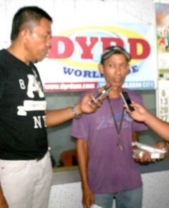 HONEST DRIVER. Reynaldo Ingking, tricycle driver interviewed by DyRD anchorman Atoy Cosap when he returned to the radio station P88,135.00 left in his tricycle unit yesterday afternoon.