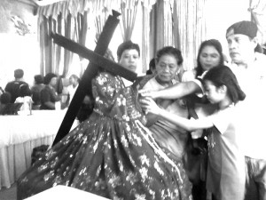 Devotees try to touch the statue of the Black Nazarene in Mt. Calvary in Garcia-Hernandez town Saturday during the feast of the Black Nazarene.  Contributed Photo/Genevieve Virador 
