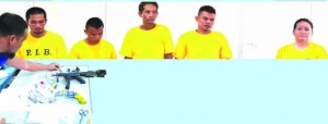 DRUG QUEEN. Maida Quimson Jabines (right) together with other drug suspects Daryl Louie Quimson, Ruel Vitor, James Louie Bongalos and Rosulo Pamaong nabbed last Friday in possession of P25 million worth of shabu as well s firearms in a house along JA Clarin st., this city.