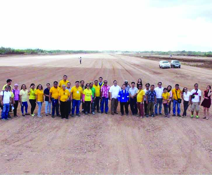 RUNWAY. Members of the press pose at the runway of the New Bohol Airport in Panglao during an ocular inspection led by Prov'l Administrator Ae Damalerio