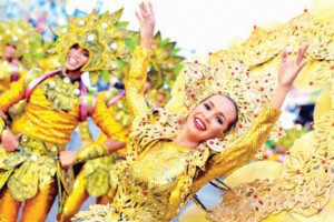SAULOG Festival King and Queen of Barangay Dao gaily show off their colorful costume during the Grand Street Dancing parade last year.