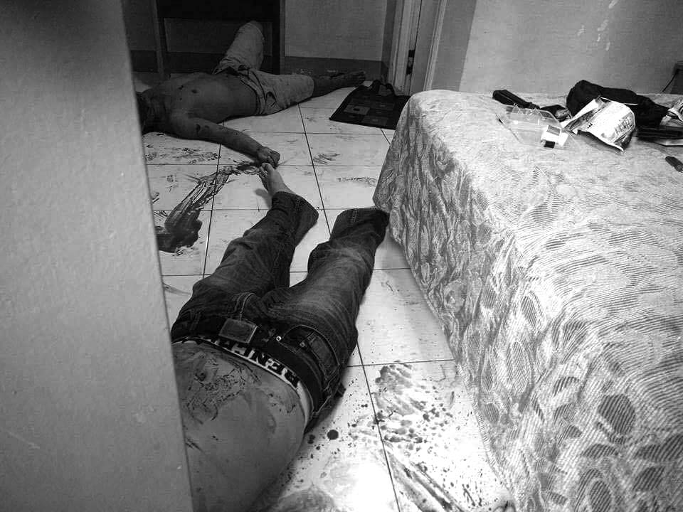 DEAD END. Two suspected drug dealers, one considered as a big time drug pusher identified by police as Kalvin Licong of Torero Private Road, Cogon District and his unidentified companion are sprawled on the floor of their room in a pension house along Tamblot St. Extension. The two were killed by police operatives during a buy bust operation yesterday afternoon.